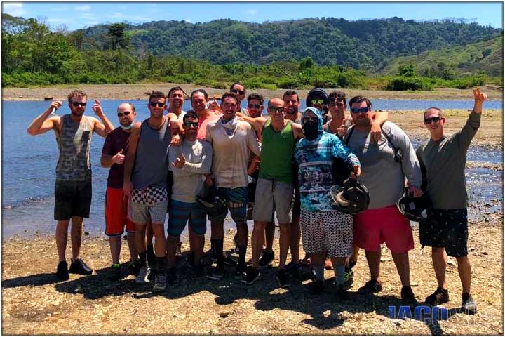 Bachelor party group of guys at Tulin river during atv tour