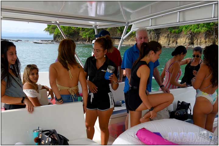 group of girls and guys on catamaran