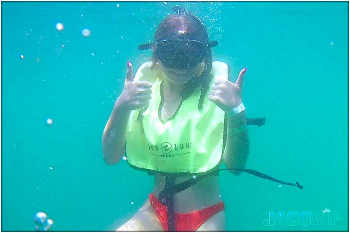 Girl underwater with snorkel and red bikini
