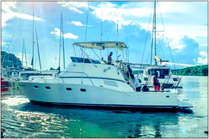 side view of boat and blue ocean water