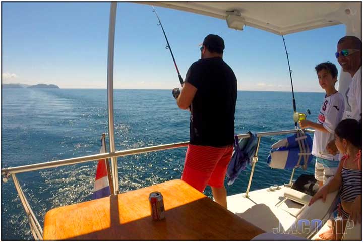 Guy fishing from party boat in costa rica