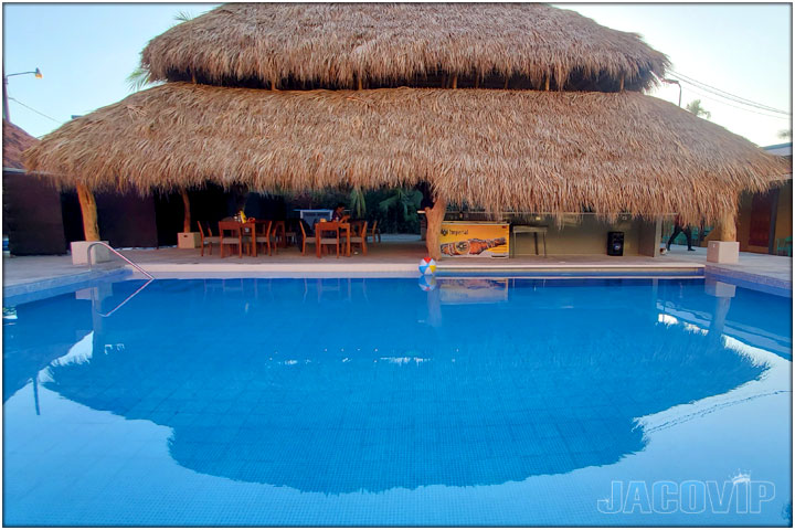 Wide Angle view of Large swimming pool and rancho