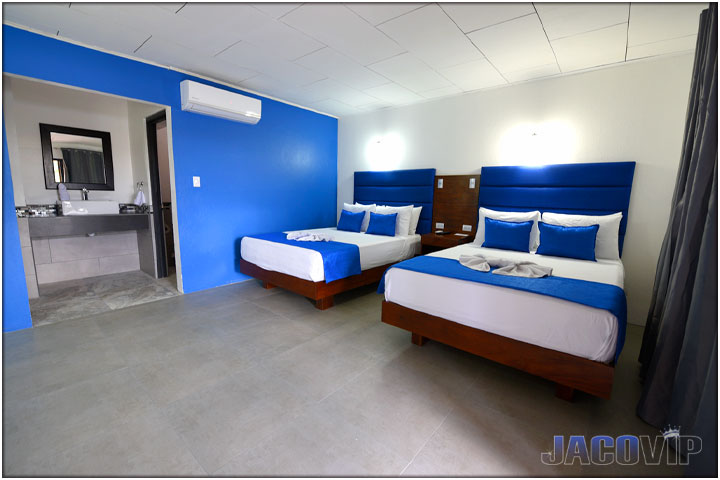 View of two beds plus bathroom