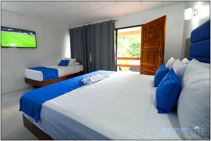 Large TV, king size bed and single daybed sofa