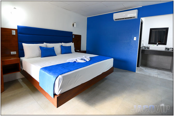 King size bed plus entrance to bathroom