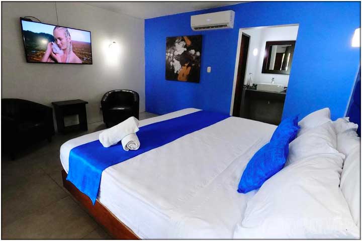 King bedroom with large TV