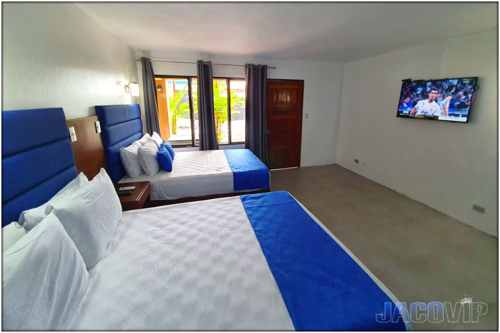 view of 2 beds plus room entrance