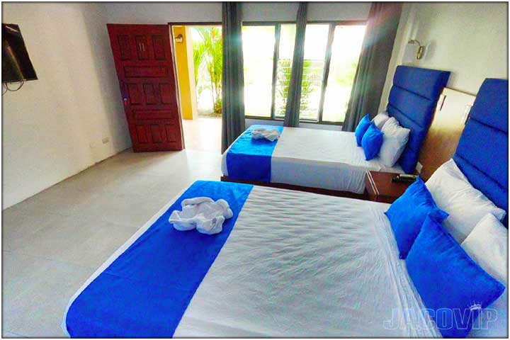 2 Double beds in Bedroom with door open