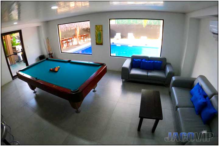 Living room with tables and commercial beer fridge