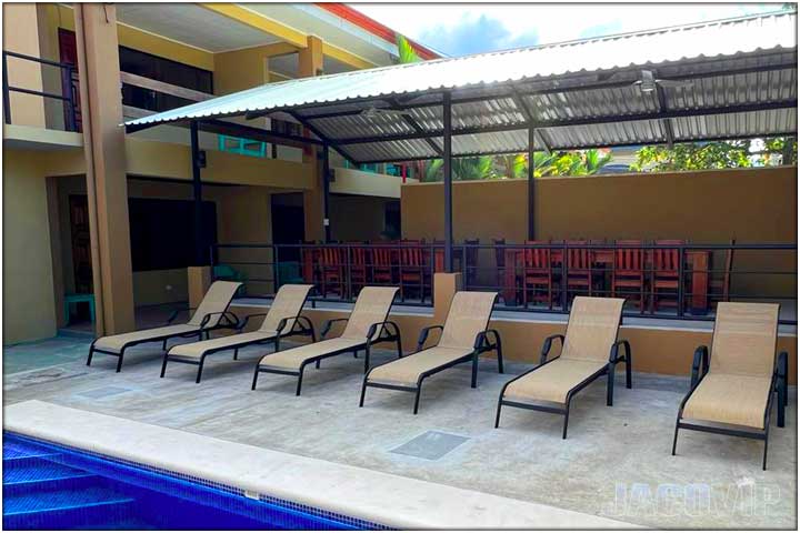 View of rancho, pool and living room window