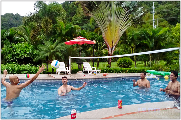Group playing water volleyball in the pool