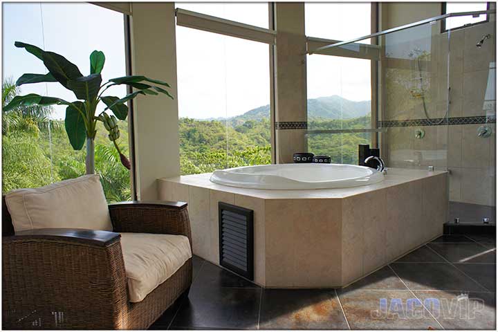 Jacuzzi in bathroom with view of mountains