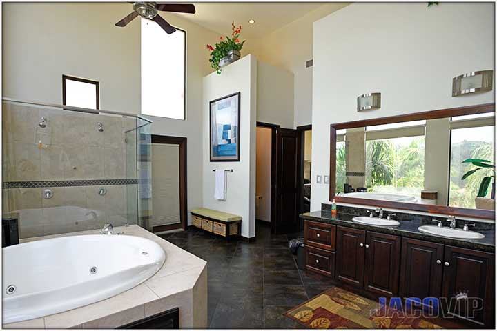 Large master bathroom with jacuzzi and views