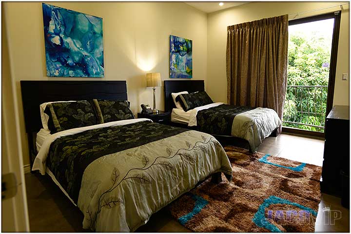 2 Queen Size beds with matching artwork on walls