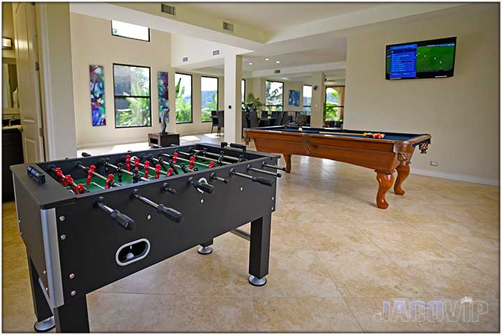 Pool table and foosball table in main living room area