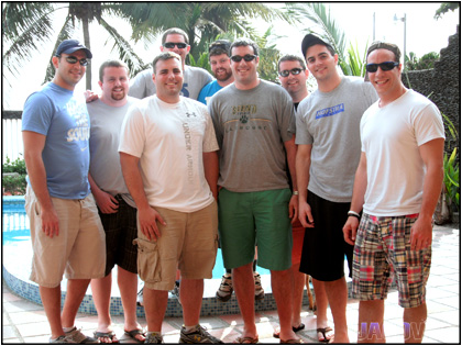 Group of guys in front of the pool