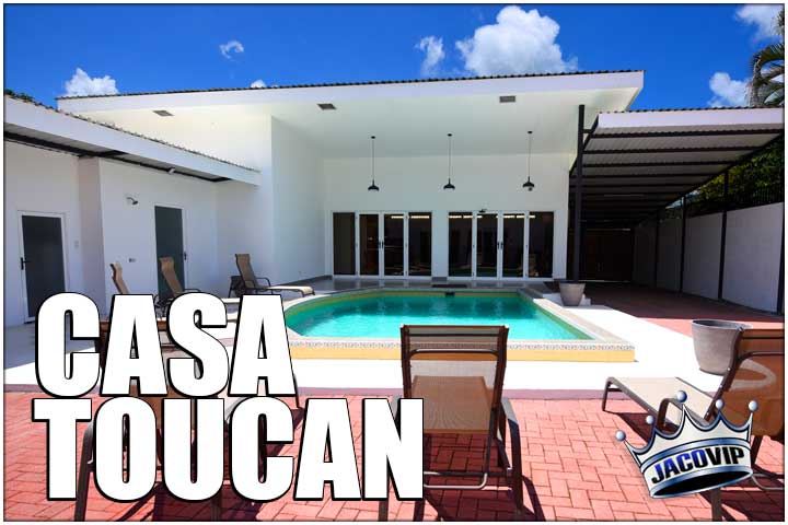 Swimming pool and lounge chairs at Casa Toucan