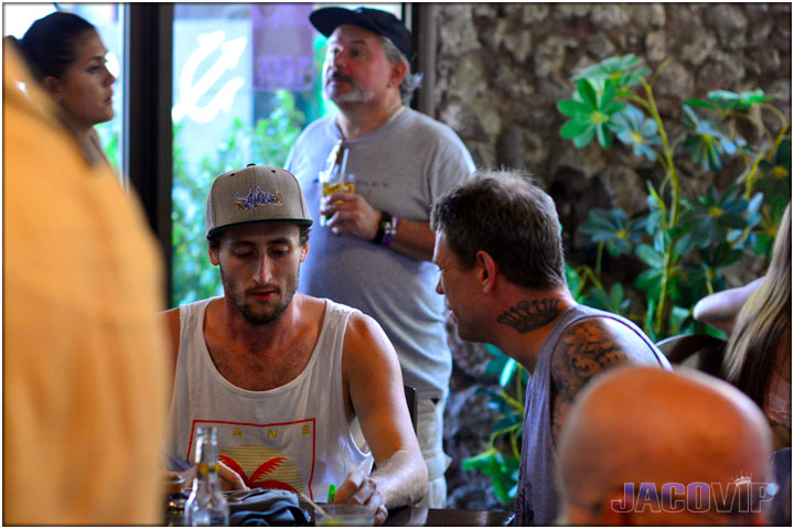 Guys eating at tables