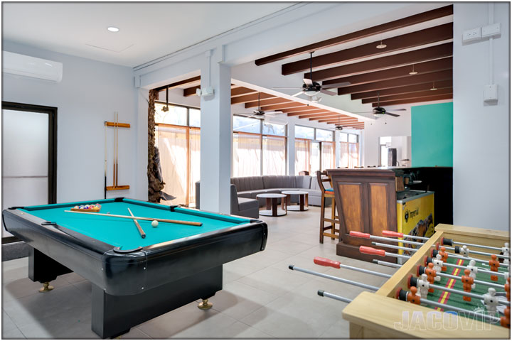 Close up of pool table and foosball table