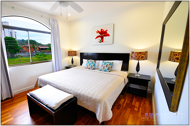King size bed with modern nightstand lamps