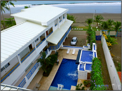 drone photo of Ocean Place Casa 9 pool and jaco beach