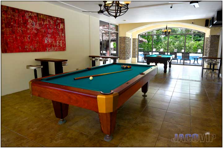 Another angle of pool tables in living room area