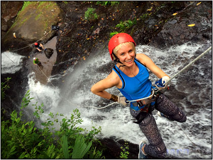 Rappeling down waterfall near Jaco