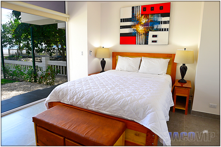 Queen size bed with ocean view in jaco