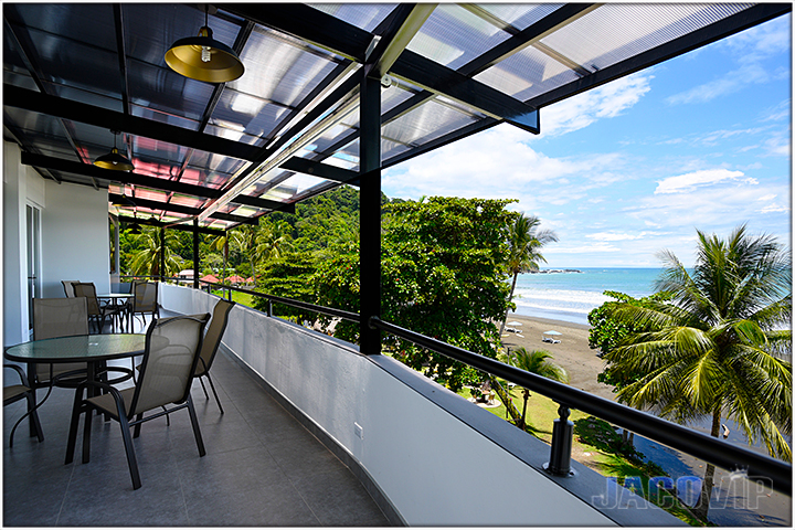 Chsirs and table on beachfront balcony