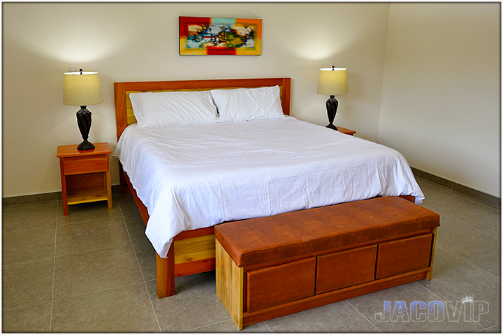 Bed with white linen and white duvet cover