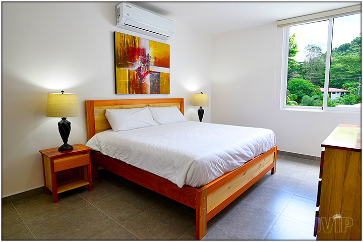 bedroom with king bed and white duvet