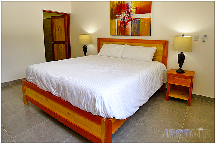 corner view of bed and modern art