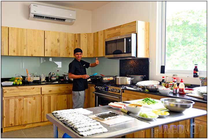 kitchen area with sushi and food preparation