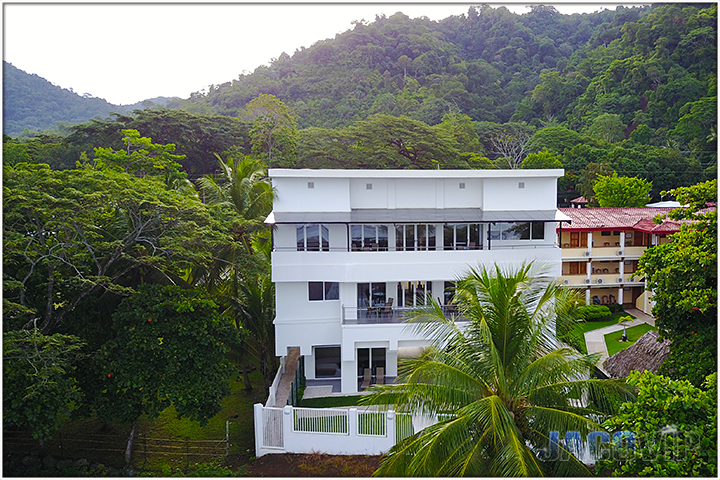 aerial drone photo of villa sea esta and mountains behind