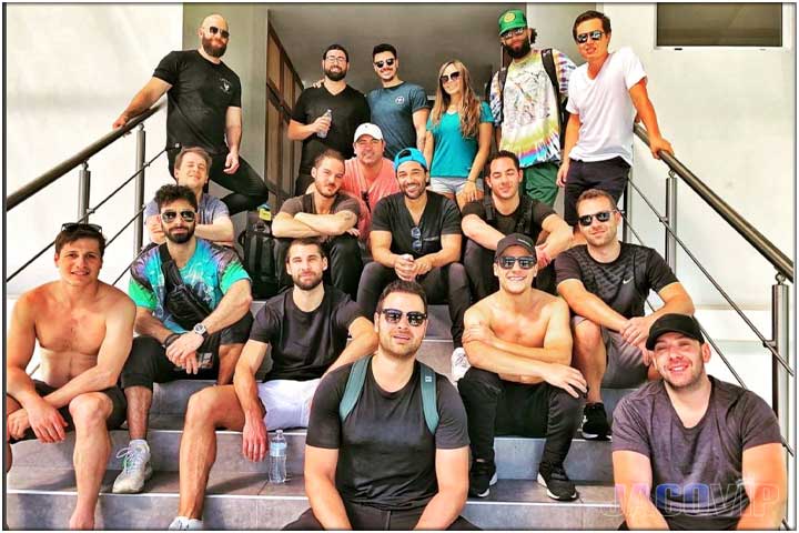 bachelor party group on staircase with concierge