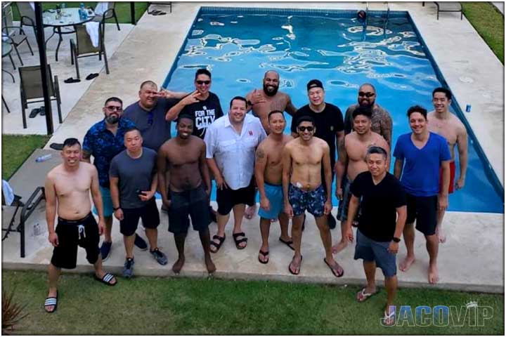 group of guys on vacation poolside