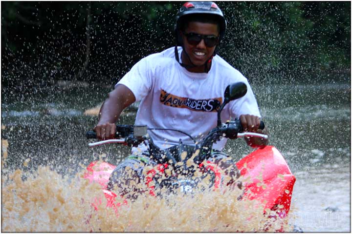 ATV splash crossing river