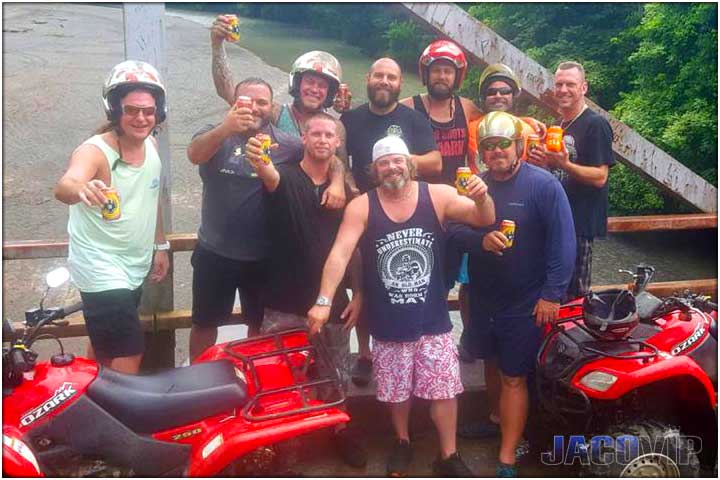 Having a beer on Tulin bridge during costa rica atv tour