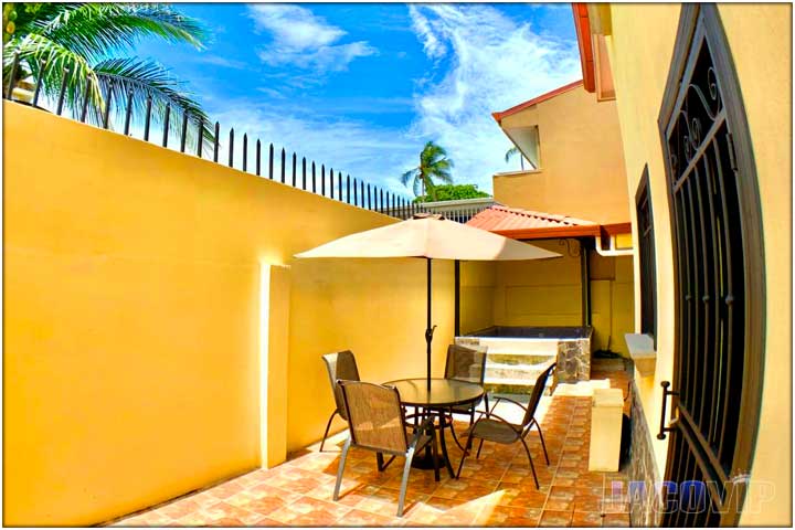 Back of house area with outdoor table and chairs