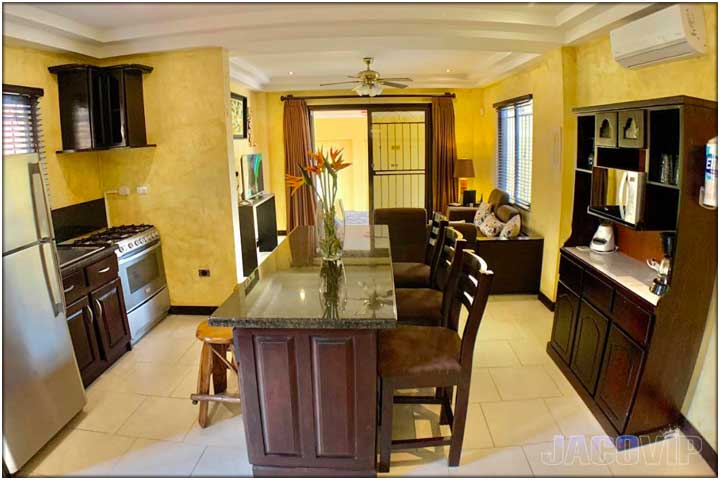 Wide angle view of kitchen and living room