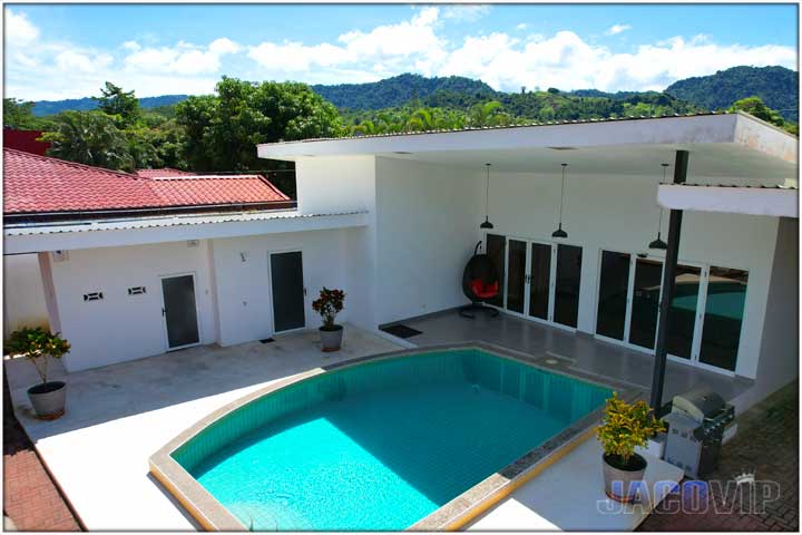 Opposite end view of pool and second house