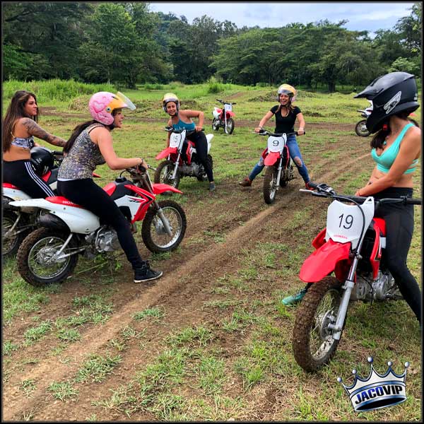 Group of women on mini dirt bikes in costa rica