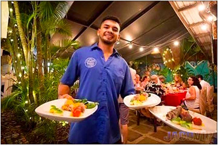 Waiter serving food at Green Room