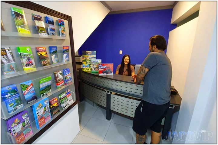 Concierge and guest at reception desk