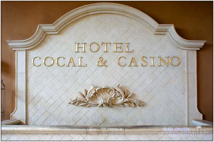 Fountain entrance and sign for Cocal Hotel and Casino