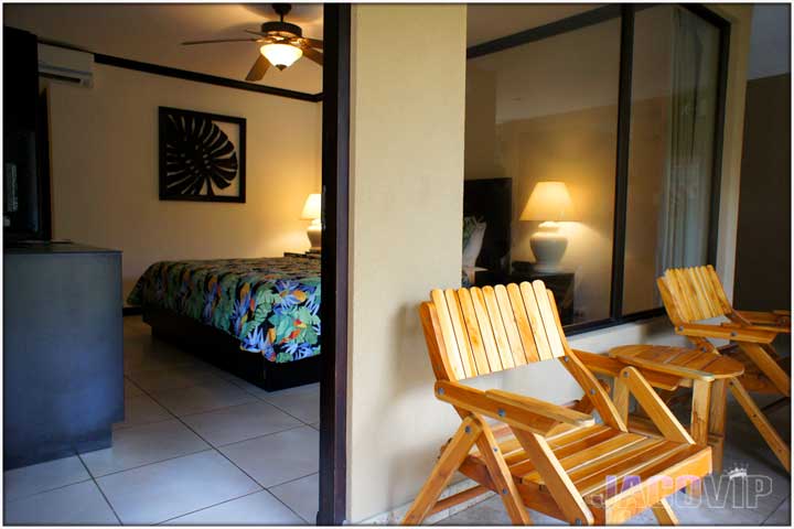 Entrance to hotel room with two wood chairs