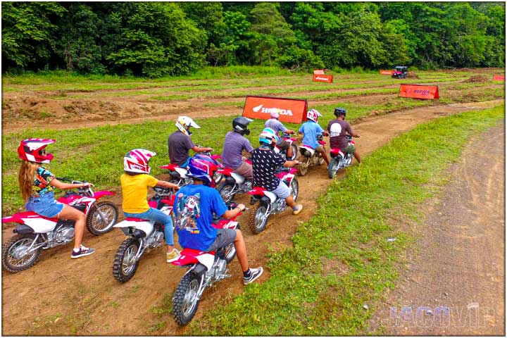 Overhead view of riders on mini dirt bike track