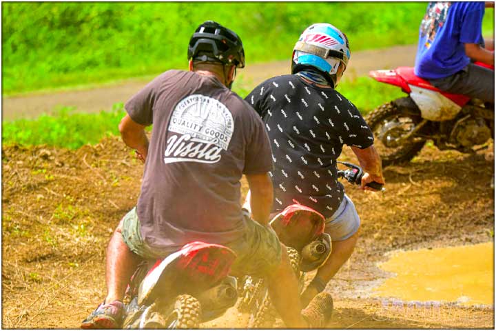 Back side of motorbikes with dust