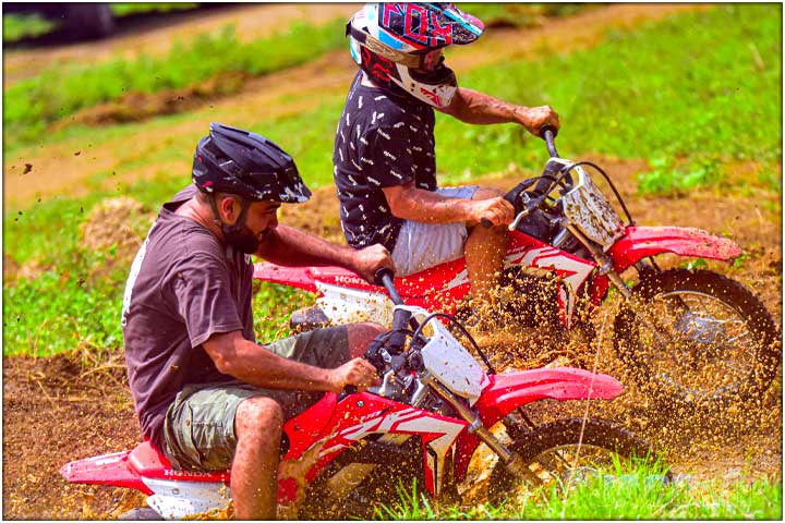 Going up and out of muddy patch in dirt track