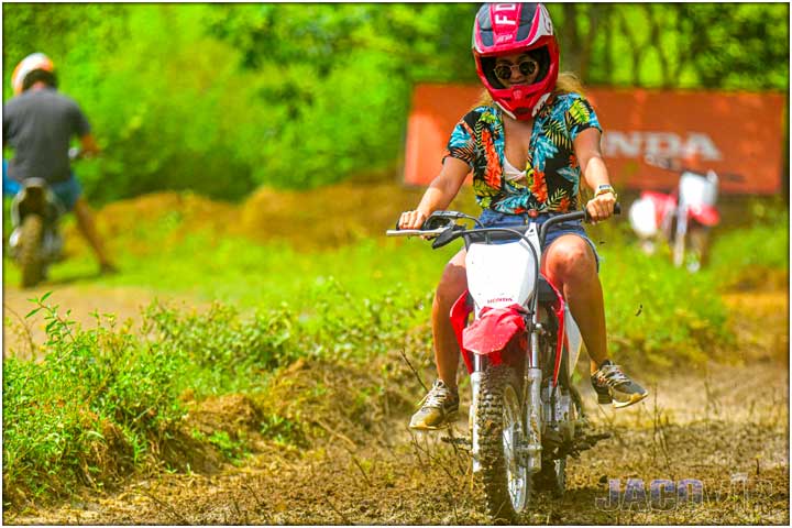 Young woman on mini dirt bike track and tour in costa rica